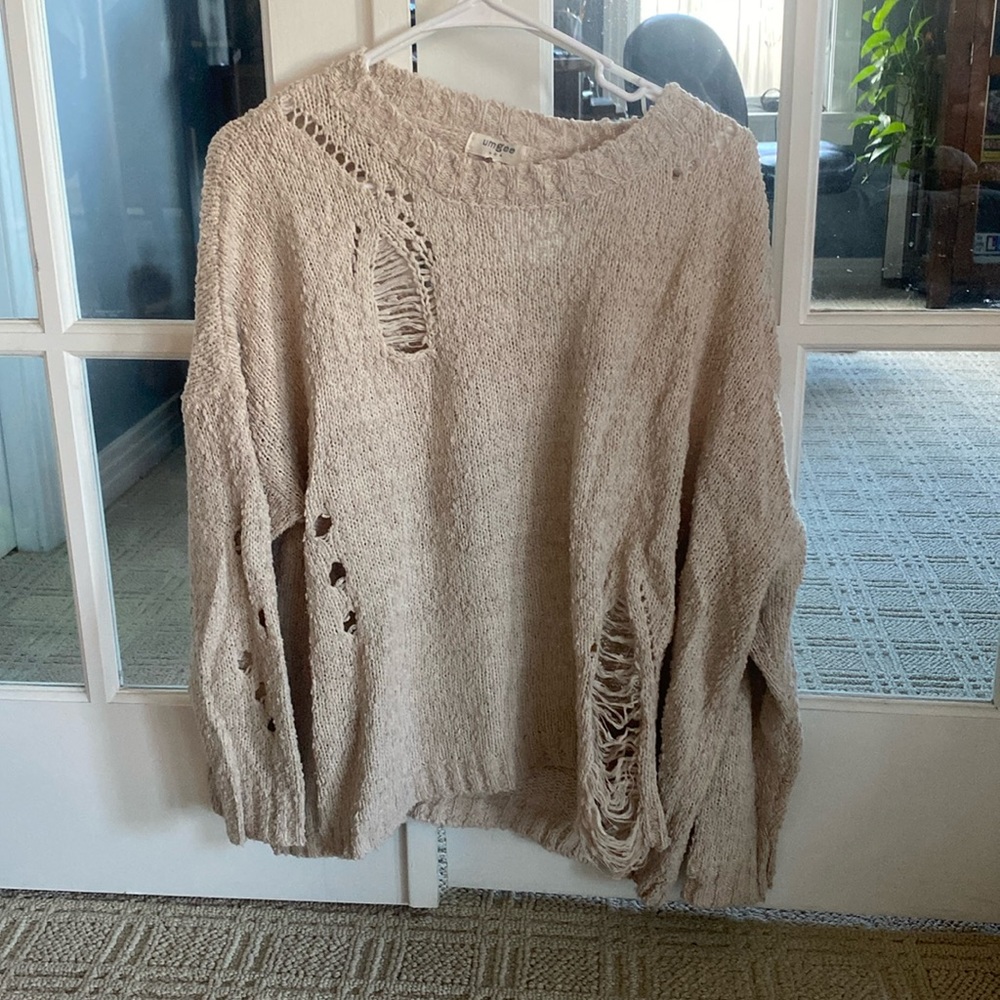Cream sweater with ripped cut outs